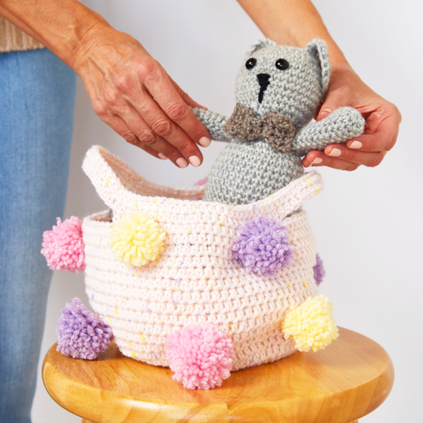If you’re looking for an easy way to create more storage for a room, this Pom Pom Storage Basket is perfect. #crochetbasket #crochetpattern #crochetlove #crochetaddict