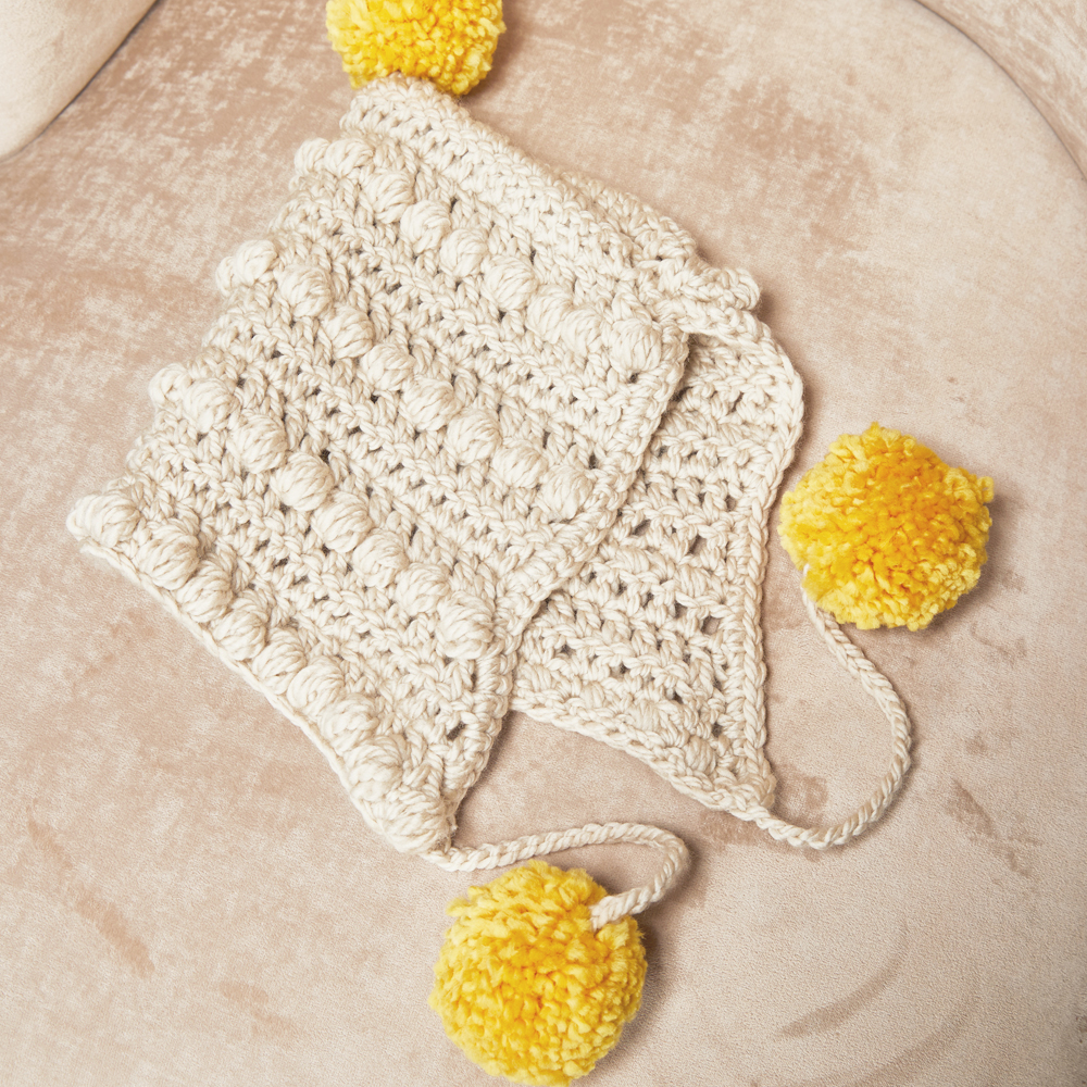 The baby pom pom hat is the perfect gift to keep tiny ears warm and protected this season. #crochethat #crochetpattern #crochetlove #crochetaddict