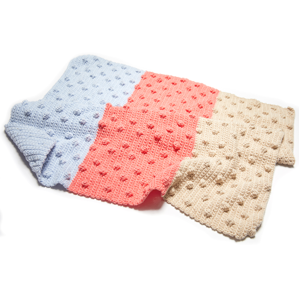 The Bobble Stitch Blanket is an incredible pattern that is easy to follow and really fun to make. #crochetblanket #crochetpattern #crochetlove #crochetaddict
