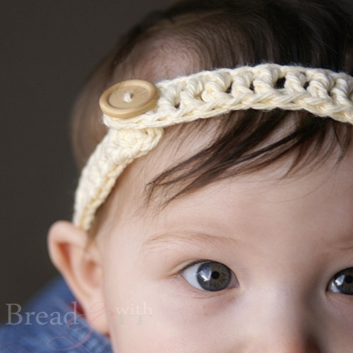 Baby Button Headband - This list of unique crochet baby headbands for girls are sweet and simple. You can whip these free crochet patterns up in no time, and there are so many options. #CrochetBabyHeadbands #BabyHeadbandPatterns #FreeCrochetPattern