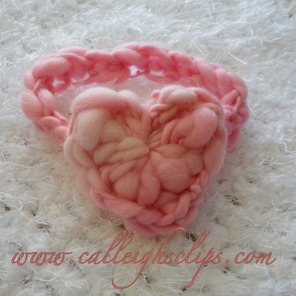 Chain-less Foundation Heart Headband - This list of unique crochet baby headbands for girls are sweet and simple. You can whip these free crochet patterns up in no time, and there are so many options. #CrochetBabyHeadbands #BabyHeadbandPatterns #FreeCrochetPattern