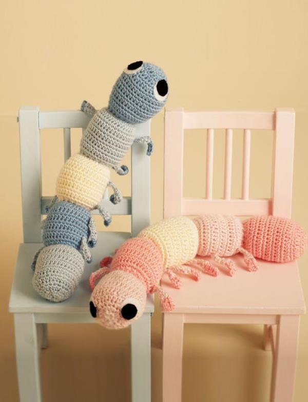 Caterpillar Cuddle Buddy - These crochet pillows are fun and an adventure to make. If you’re looking for creative kids pillows, this list will be your go to. #CrochetPillowPatterns #CrochetPatterns #CrochetAddict