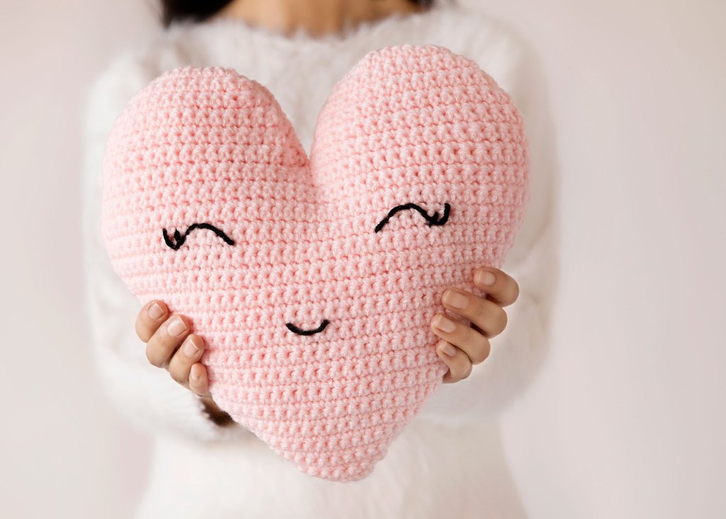 Heart-shaped Pillow - These crochet pillows are fun and an adventure to make. If you’re looking for creative kids pillows, this list will be your go to. #CrochetPillowPatterns #CrochetPatterns #CrochetAddict