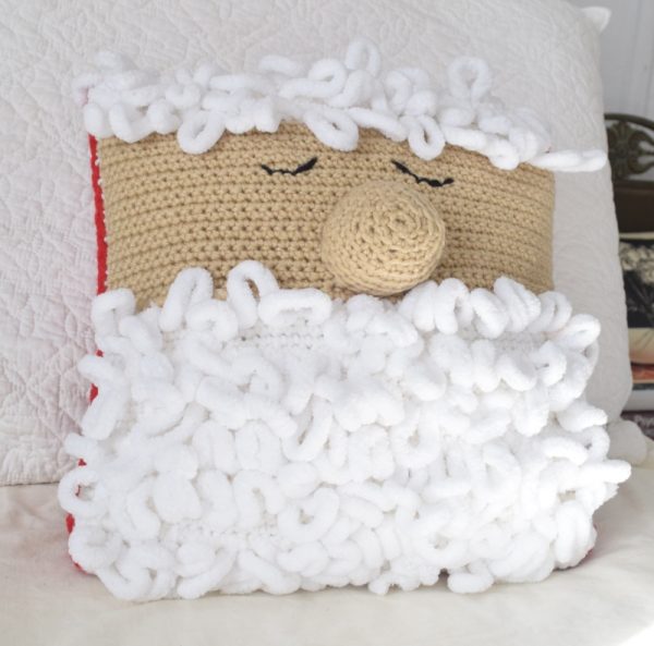 Sleepy Santa Pillow - These crochet pillows are fun and an adventure to make. If you’re looking for creative kids pillows, this list will be your go to. #CrochetPillowPatterns #CrochetPatterns #CrochetAddict
