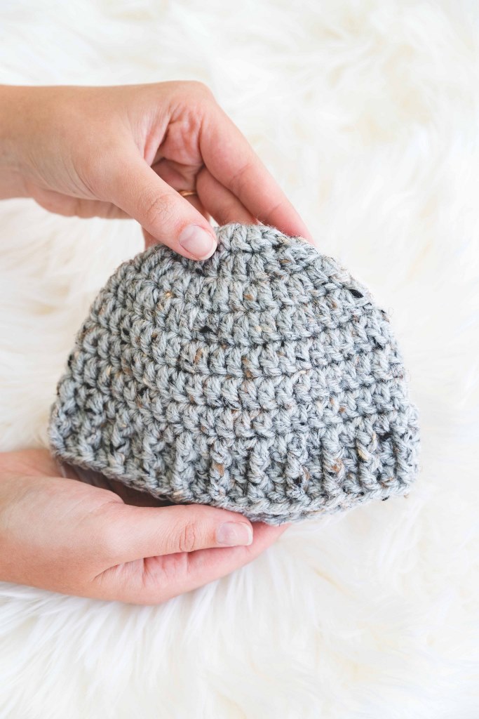 The Parker Hat - These free newborn crochet hat patterns are fun and easy to work on. These baby accessories are so fast to make and anyone can do it. #CrochetBabyHatPatterns #CrochetHatPatterns #CrochetNewbornHats