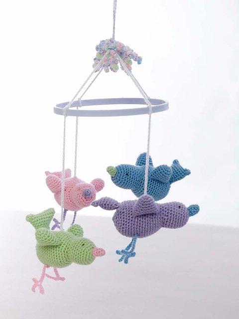 Baby Birdie Mobile - Crochet baby mobiles are colorful, fun and creative. Grab your hook and your favorite type of yarn, and get started on a baby mobile for someone you know. #CrochetBabyMobiles #CrochetPatterns #FreeCrochetPatterns
