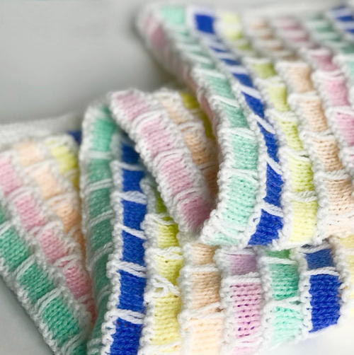 Brick and Mortar Baby Blanket - Each of these baby blanket knitting patterns is suitable for any skill level and is fun to make. The best part is how colorful they all are and how versatile. #BabyBlanketKnittingPatterns #KnitBabyBlankets #FreeKnitPatterns