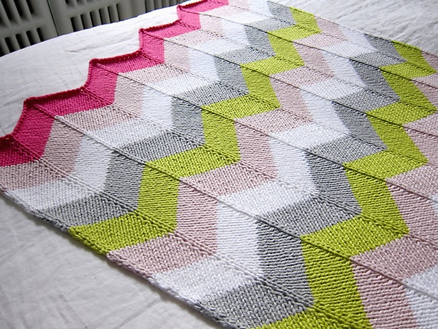 Chevron Baby Blanket - Each of these baby blanket knitting patterns is suitable for any skill level and is fun to make. The best part is how colorful they all are and how versatile. #BabyBlanketKnittingPatterns #KnitBabyBlankets #FreeKnitPatterns