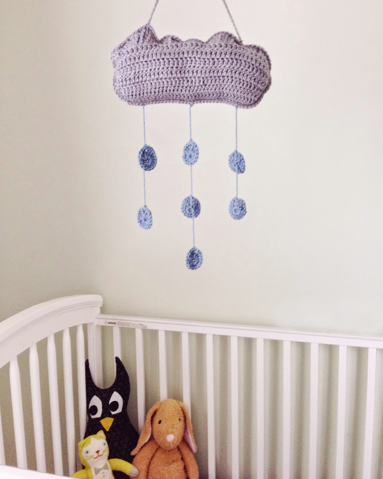 Clouds and Raindrops Nursery Mobile - Crochet baby mobiles are colorful, fun and creative. Grab your hook and your favorite type of yarn, and get started on a baby mobile for someone you know. #CrochetBabyMobiles #CrochetPatterns #FreeCrochetPatterns