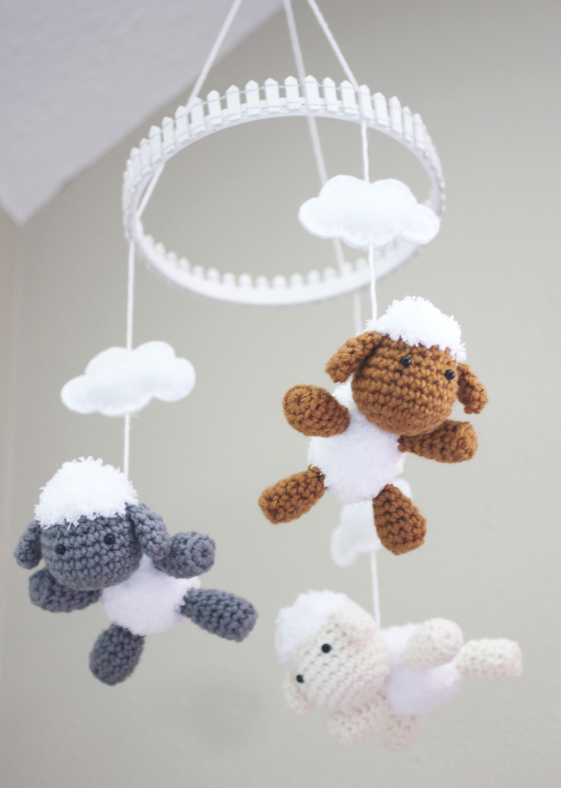 Lamb and Baby Mobile - Crochet baby mobiles are colorful, fun and creative. Grab your hook and your favorite type of yarn, and get started on a baby mobile for someone you know. #CrochetBabyMobiles #CrochetPatterns #FreeCrochetPatterns