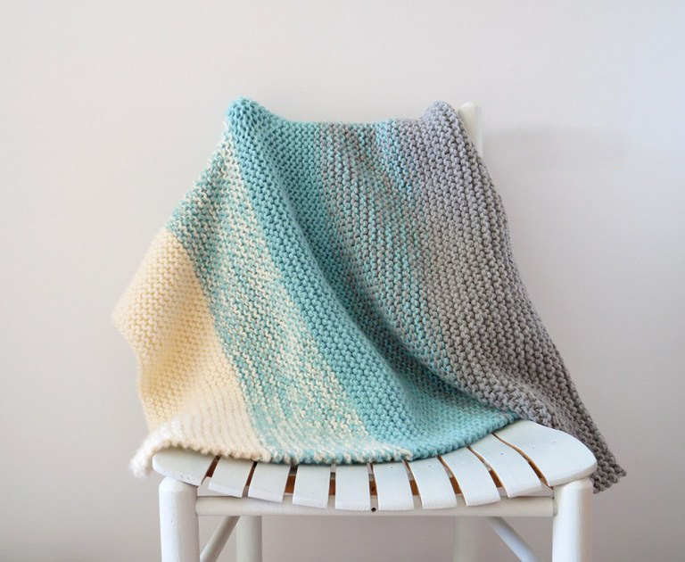 Easy Knit Baby Blanket - Each of these baby blanket knitting patterns is suitable for any skill level and is fun to make. The best part is how colorful they all are and how versatile. #BabyBlanketKnittingPatterns #KnitBabyBlankets #FreeKnitPatterns