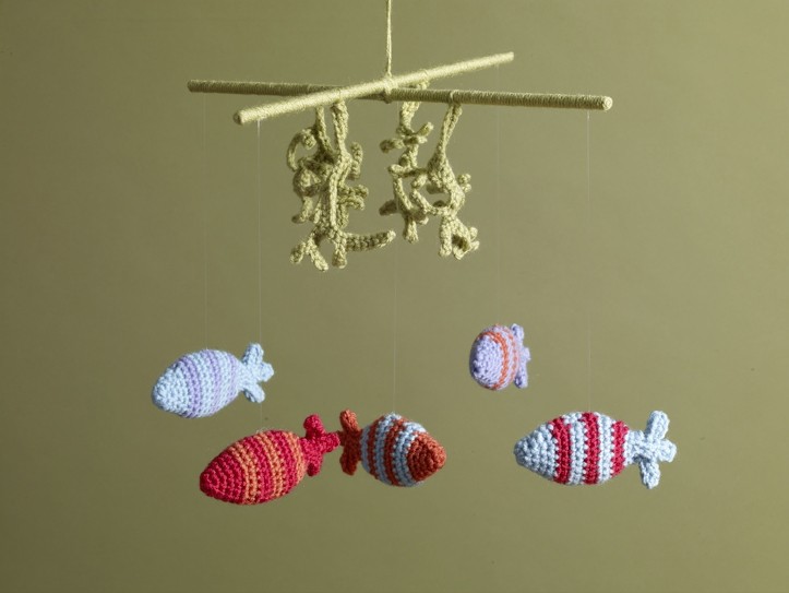 Undersea Crochet Mobile - Crochet baby mobiles are colorful, fun and creative. Grab your hook and your favorite type of yarn, and get started on a baby mobile for someone you know. #CrochetBabyMobiles #CrochetPatterns #FreeCrochetPatterns