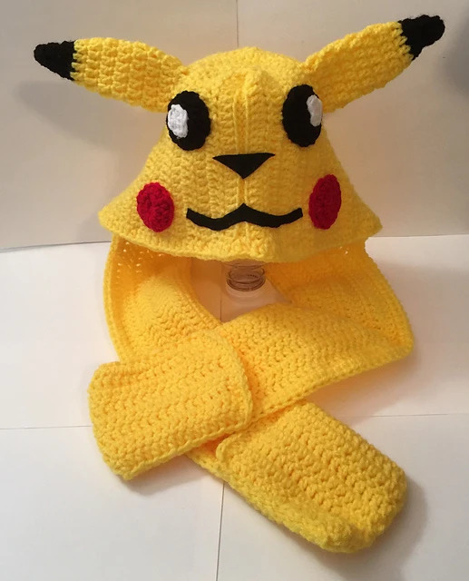 Pikachu Scoodie - These hooded free crochet scarf patterns are excellent alternatives to full-blown costumes when your kid is not into that kind of thing. #freecrochetscarfpatterns #crochetscarf 