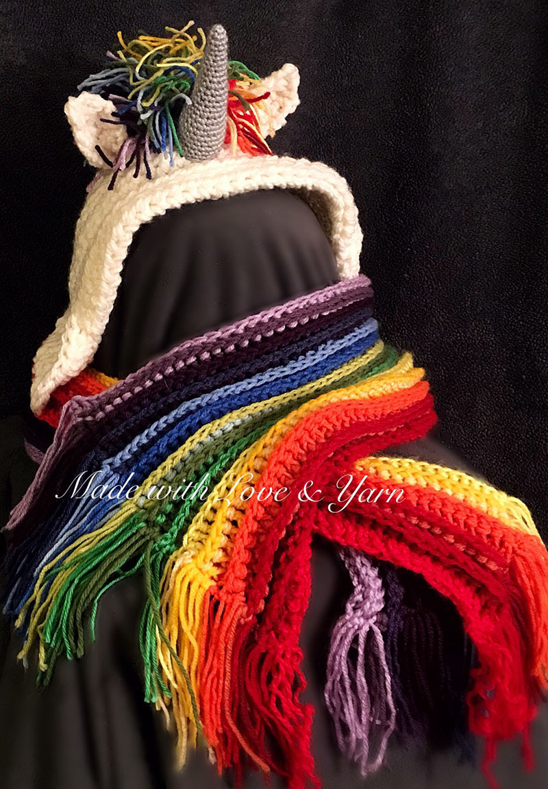 Rainbow Unicorn Hooded Scarf - These hooded free crochet scarf patterns are excellent alternatives to full-blown costumes when your kid is not into that kind of thing. #freecrochetscarfpatterns #crochetscarf 
