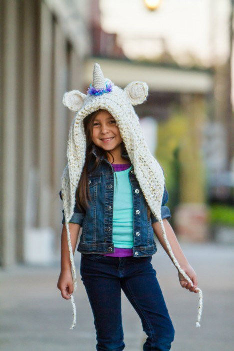 Unicorn Hood - These hooded free crochet scarf patterns are excellent alternatives to full-blown costumes when your kid is not into that kind of thing. #freecrochetscarfpatterns #crochetscarf 