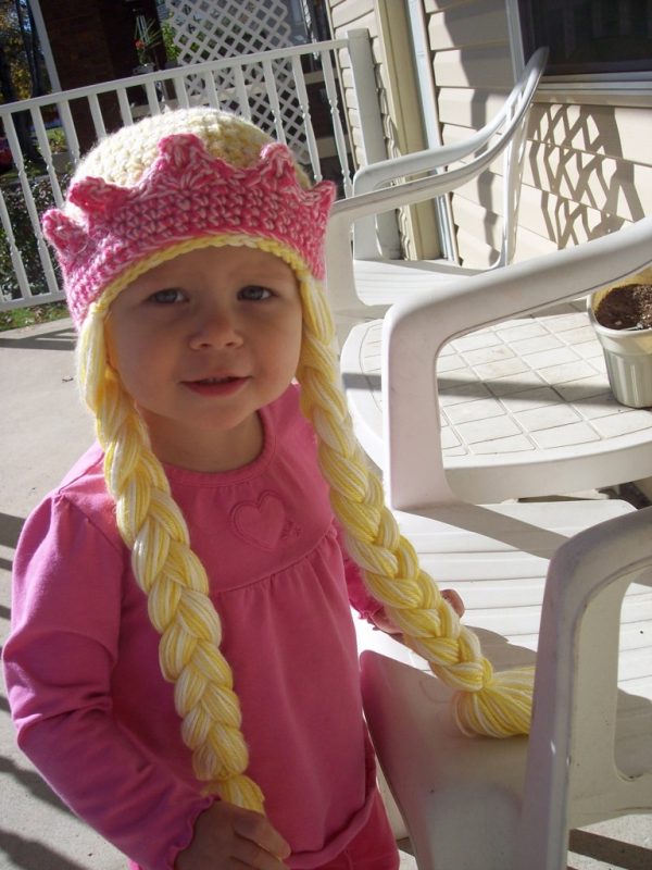 Beautifully Braided Princess Hat - If you’re looking for something to wear for your children this Halloween, these 13 spooky crochet hat patterns for kids is a start. #kidscrochethat #crochethatpatterns #spookycrochethat