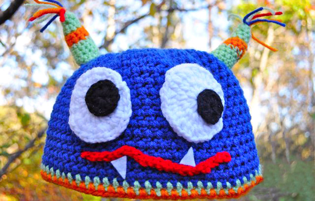 Crochet Monster Hat - If you’re looking for something to wear for your children this Halloween, these 13 spooky crochet hat patterns for kids is a start. #kidscrochethat #crochethatpatterns #spookycrochethat