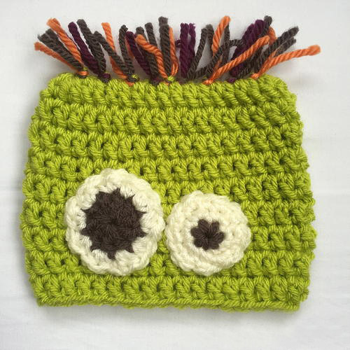 Scared Silly Monster Baby Hat - If you’re looking for something to wear for your children this Halloween, these 13 spooky crochet hat patterns for kids is a start. #kidscrochethat #crochethatpatterns #spookycrochethat