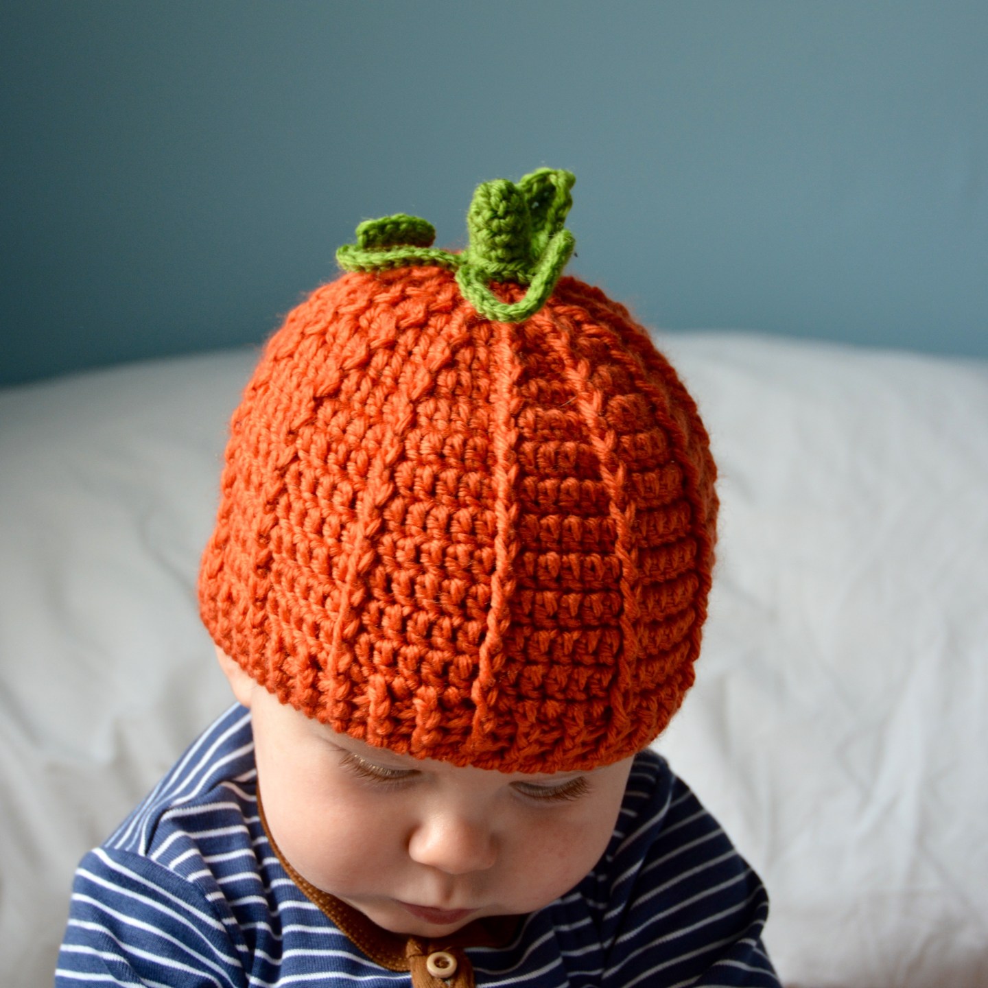 The Pumpkin Beanie Hat - If you’re looking for something to wear for your children this Halloween, these 13 spooky crochet hat patterns for kids is a start. #kidscrochethat #crochethatpatterns #spookycrochethat