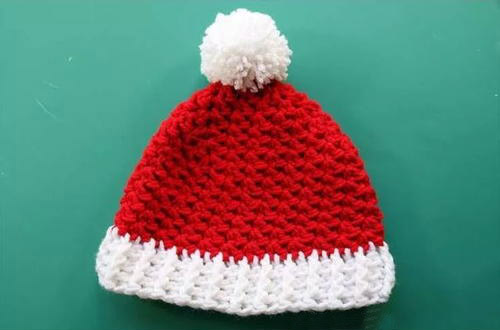 Child Crochet Santa Hat - This list of Christmas Crochet hat patterns will supply you with anything from the classics (Santa, Rudolph, Snowman) to fun animals and well-loved characters. #ChristmasCrochetHatPatterns #CrochetHatPatterns #CrochetPatterns