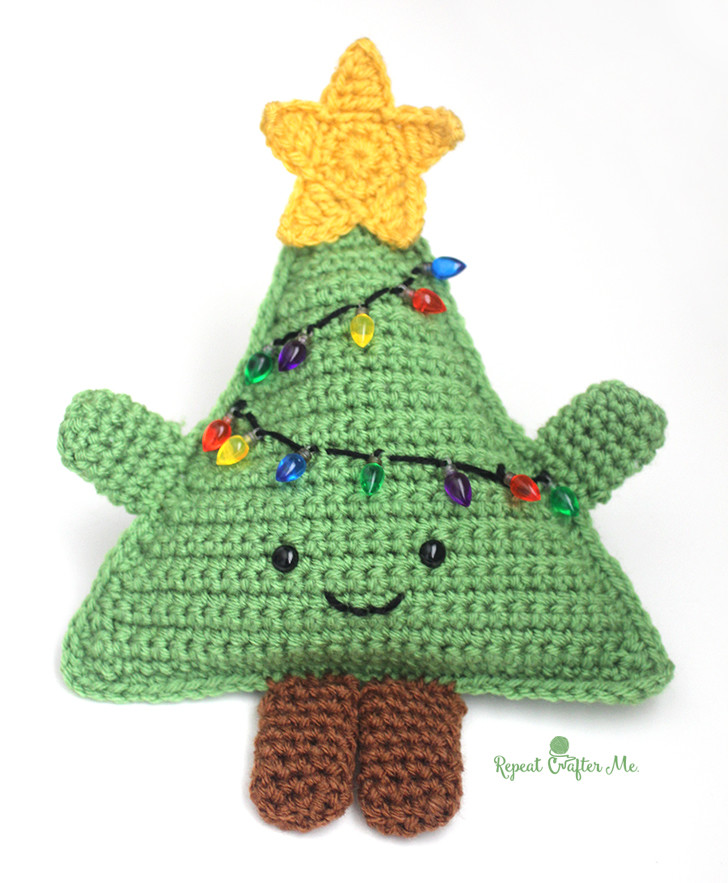 Huggable Crochet Christmas Tree - Fill this holiday season with crochet toy projects that will fill your home with more joy than ever before. #crochettoys #christmastoys #crochetamigurumi