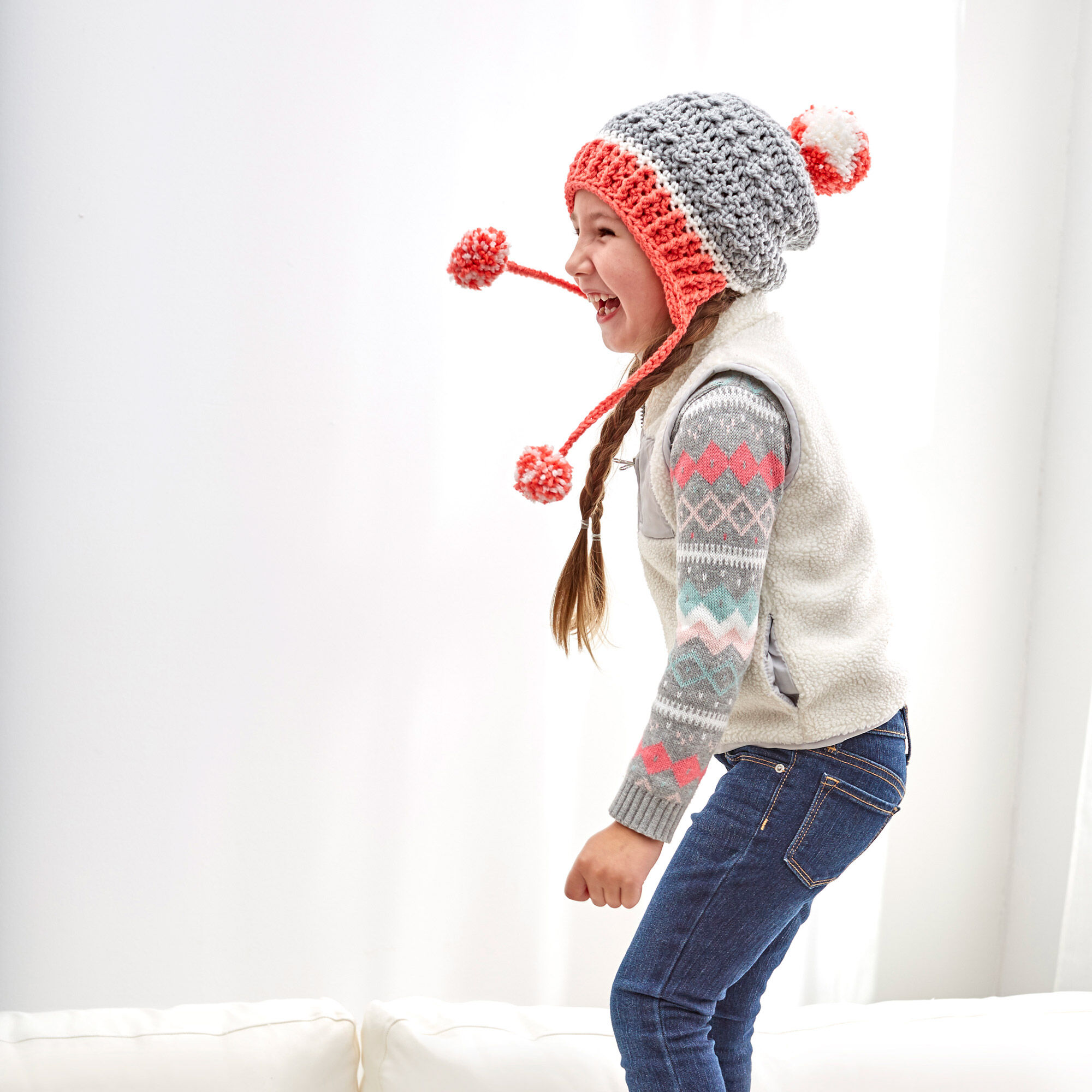Little Miss PomPom Hat - This list of Christmas Crochet hat patterns will supply you with anything from the classics (Santa, Rudolph, Snowman) to fun animals and well-loved characters. #ChristmasCrochetHatPatterns #CrochetHatPatterns #CrochetPatterns