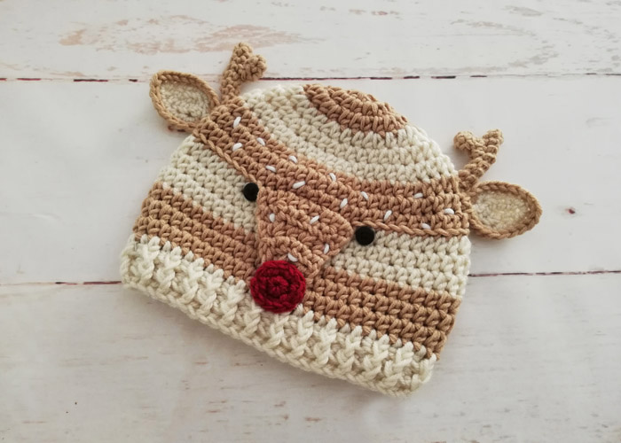 Woodland Spotted Deer Hat - This list of Christmas Crochet hat patterns will supply you with anything from the classics (Santa, Rudolph, Snowman) to fun animals and well-loved characters. #ChristmasCrochetHatPatterns #CrochetHatPatterns #CrochetPatterns