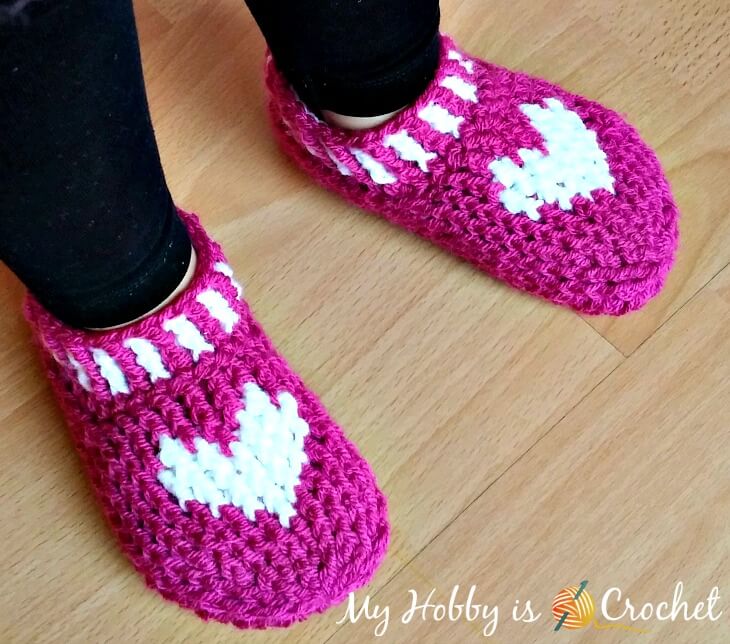 Heart & Sole Slippers - One way you can show your love for kids this Valentine’s is by crocheting these simple crochet patterns. #simplecrochetpatterns #crochetpatterns #kidscrochetpatterns