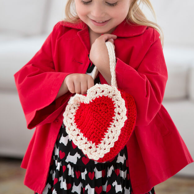 Here's My Heart Gift Bag - One way you can show your love for kids this Valentine’s is by crocheting these simple crochet patterns. #simplecrochetpatterns #crochetpatterns #kidscrochetpatterns
