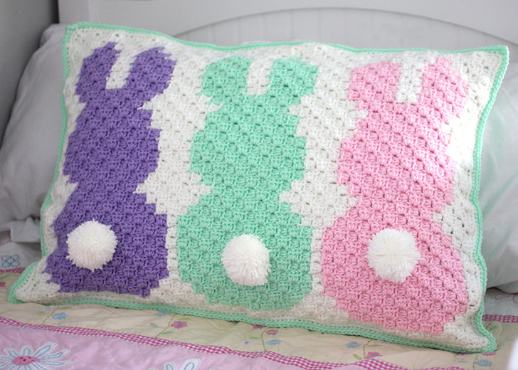 Crochet C2C Bunny Pillow Sham - If you’re looking to learn a new crochet skill, check out these 12 corner to corner crochet patterns. #cornertocornercrochetpatterns #C2Ccrochetpatterns #crochetpatterns