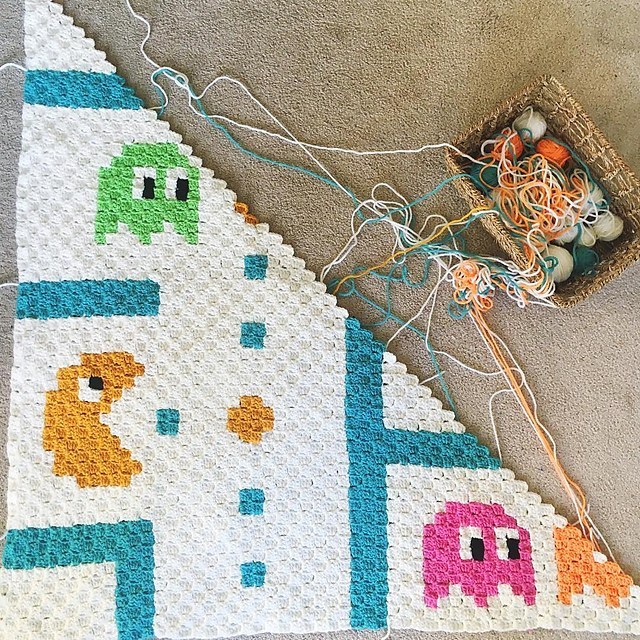 Pacman C2C Baby Blanket - If you’re looking to learn a new crochet skill, check out these 12 corner to corner crochet patterns. #cornertocornercrochetpatterns #C2Ccrochetpatterns #crochetpatterns