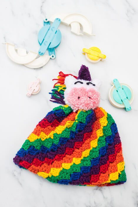 Rainbow C2C Hat - If you’re looking to learn a new crochet skill, check out these 12 corner to corner crochet patterns. #cornertocornercrochetpatterns #C2Ccrochetpatterns #crochetpatterns