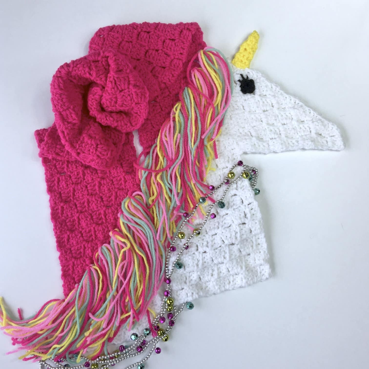 Unicorn Scarf - If you’re looking to learn a new crochet skill, check out these 12 corner to corner crochet patterns. #cornertocornercrochetpatterns #C2Ccrochetpatterns #crochetpatterns