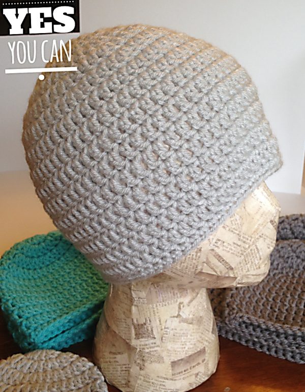 a gray crochet beanie on a mannequin head