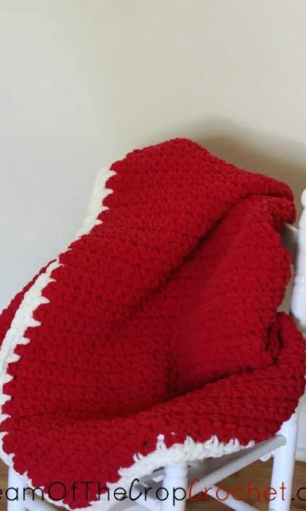 Camden Crochet Baby Blanket on a chair