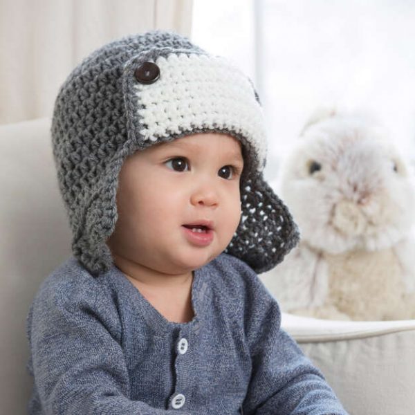 a baby wearing the Little Lindy’s Aviator Crochet Hat